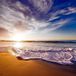Waves on the beach as the sun sets